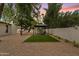 Beautiful backyard featuring a gazebo with hanging chairs, an outdoor pool, and gorgeous landscaping at 5819 E Ludlow Dr, Scottsdale, AZ 85254