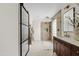 Elegant bathroom features a glass shower, double vanity, and stylish mirror at 5819 E Ludlow Dr, Scottsdale, AZ 85254