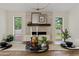 Inviting dining room with a stone fireplace and natural light at 5819 E Ludlow Dr, Scottsdale, AZ 85254