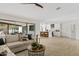 Open-concept living room and kitchen with hardwood floors and modern design at 5819 E Ludlow Dr, Scottsdale, AZ 85254