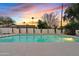 Inviting pool area at sunset featuring a pristine pool, privacy landscaping, and warm ambiance, perfect for relaxing evenings at 5819 E Ludlow Dr, Scottsdale, AZ 85254