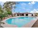 Lush backyard with a refreshing pool, gravel landscaping, and patio area, perfect for outdoor relaxation and entertainment at 5819 E Ludlow Dr, Scottsdale, AZ 85254