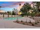 Backyard view featuring a sparkling pool and nicely manicured landscaping surrounded by tasteful decorative rock at 5819 E Ludlow Dr, Scottsdale, AZ 85254