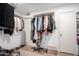 Walk-in closet with ample hanging space and shelving for shoes and folded items at 6237 E Inglewood St, Mesa, AZ 85205