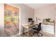 Bright home office featuring a modern desk, neutral walls, and unique beaded palm tree art at 6237 E Inglewood St, Mesa, AZ 85205