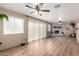 Spacious living room featuring a fireplace, hardwood flooring, and ample natural light at 6237 E Inglewood St, Mesa, AZ 85205