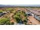 Aerial view displaying the expansive property with a mix of open land and tree coverage near modern residences at 6648 S 27Th Ave, Phoenix, AZ 85041