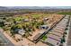 Aerial view of property with its location amongst other homes and open fields with mountain views at 6648 S 27Th Ave, Phoenix, AZ 85041