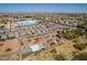 Aerial view of residences and buildings with storage sheds, equipment, and city views at 6648 S 27Th Ave, Phoenix, AZ 85041