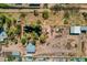 Expansive aerial view showcasing the property with lush greenery and large metal storage buildings at 6648 S 27Th Ave, Phoenix, AZ 85041