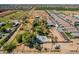 Aerial view of property showcasing its location amongst other homes and open fields at 6648 S 27Th Ave, Phoenix, AZ 85041