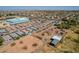 Aerial view of residences and buildings with storage sheds, equipment, and city views at 6648 S 27Th Ave, Phoenix, AZ 85041