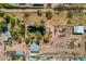 Expansive aerial view showcasing the property with lush greenery and large metal storage buildings at 6648 S 27Th Ave, Phoenix, AZ 85041