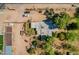 Aerial view of property showcasing its unique layout, mature trees, and proximity to the main street at 6648 S 27Th Ave, Phoenix, AZ 85041