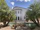 Back of a home with a rock pool and palm trees in the back yard at 6834 E Culver St, Mesa, AZ 85207