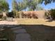 A beautiful, serene backyard featuring a sidewalk and bench and views of the landscape at 6834 E Culver St, Mesa, AZ 85207