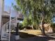 Backyard view with a spiral staircase leading up to a balcony area at 6834 E Culver St, Mesa, AZ 85207