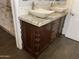 Elegant bathroom features a double sink vanity with granite countertop and decorative wood carvings at 6834 E Culver St, Mesa, AZ 85207