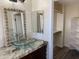 Bathroom featuring a glass bowl sink, granite counters, and wood cabinets at 6834 E Culver St, Mesa, AZ 85207