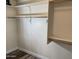 A large closet featuring built-in shelves and wooden clothing rods at 6834 E Culver St, Mesa, AZ 85207