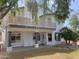 Two-story home with a white exterior, balcony, and mature landscaping at 6834 E Culver St, Mesa, AZ 85207