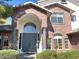 Inviting front entrance with a brick facade, arched doorway, and well-maintained landscaping at 6834 E Culver St, Mesa, AZ 85207