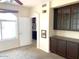 Office space with built-in cabinetry, carpeted floors, and view of the backyard at 6834 E Culver St, Mesa, AZ 85207