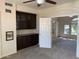 Home office with built-in cabinetry, carpet floors and neutral paint, creating an efficient workspace at 6834 E Culver St, Mesa, AZ 85207