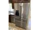 KitchenAid stainless steel refrigerator with freezer drawers and water dispenser at 6834 E Culver St, Mesa, AZ 85207