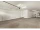 Spacious garage with a water heater and a service door at 717 E Deer Creek Rd, Phoenix, AZ 85048