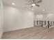 Spacious living room featuring plank floors, modern railings, and plenty of natural light at 717 E Deer Creek Rd, Phoenix, AZ 85048