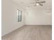 Bright living room featuring wood-style floors, modern ceiling fan, recessed lighting, and neutral wall paint at 717 E Deer Creek Rd, Phoenix, AZ 85048