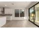 Bright living space with a large sliding door adjacent to the kitchen, offering a seamless transition to the outdoors at 717 E Deer Creek Rd, Phoenix, AZ 85048