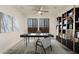 Inviting home office featuring a modern desk, shelving unit, and neutral color palette at 717 E Deer Creek Rd, Phoenix, AZ 85048