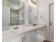 Bright bathroom featuring double sinks, white cabinets and quartz counters at 8014 N 55Th Ave, Glendale, AZ 85302