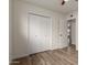 Bright bedroom featuring wood-look floors, large closet and neutral walls at 8014 N 55Th Ave, Glendale, AZ 85302