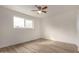 Bedroom with neutral walls, ceiling fan and vinyl floors at 8014 N 55Th Ave, Glendale, AZ 85302