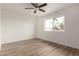 Bedroom featuring a ceiling fan and hardwood floors at 8014 N 55Th Ave, Glendale, AZ 85302