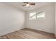 Bedroom features hardwood floors, neutral walls and ceiling fan at 8014 N 55Th Ave, Glendale, AZ 85302