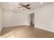 Bright living room featuring tile floors, a ceiling fan, and recessed lighting at 8014 N 55Th Ave, Glendale, AZ 85302