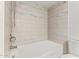 Bathroom featuring bright white tiled walls surrounding the tub and shower at 812 W Rosal Pl, Chandler, AZ 85225