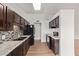 Bright kitchen shows wooden cabinets, speckled countertops, and a black appliance package at 812 W Rosal Pl, Chandler, AZ 85225