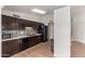 Well-lit kitchen features wooden cabinets, a black appliance package, and a stylish backsplash at 812 W Rosal Pl, Chandler, AZ 85225