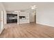 Spacious living area featuring hardwood floors, a ceiling fan, and access to the kitchen at 812 W Rosal Pl, Chandler, AZ 85225