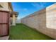 Spacious backyard offers privacy with block wall and easy lawn maintenance with artificial grass at 919 S Pheasant Dr, Gilbert, AZ 85296