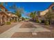 Scenic walkway through a well-maintained community with mature trees and lush landscaping at 919 S Pheasant Dr, Gilbert, AZ 85296