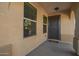 Covered entryway featuring a security door, adjacent windows, and a welcome mat at 919 S Pheasant Dr, Gilbert, AZ 85296