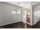 A second-floor hallway features hardwood floors, windows with blinds, and neutral colored paint at 919 S Pheasant Dr, Gilbert, AZ 85296