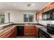 Functional kitchen featuring stainless steel appliances, dark countertops, and tile backsplash at 919 S Pheasant Dr, Gilbert, AZ 85296