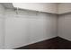 Empty walk-in closet with dark floors and metal shelving at 919 S Pheasant Dr, Gilbert, AZ 85296